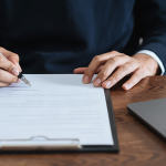 person-signing-document700-3001